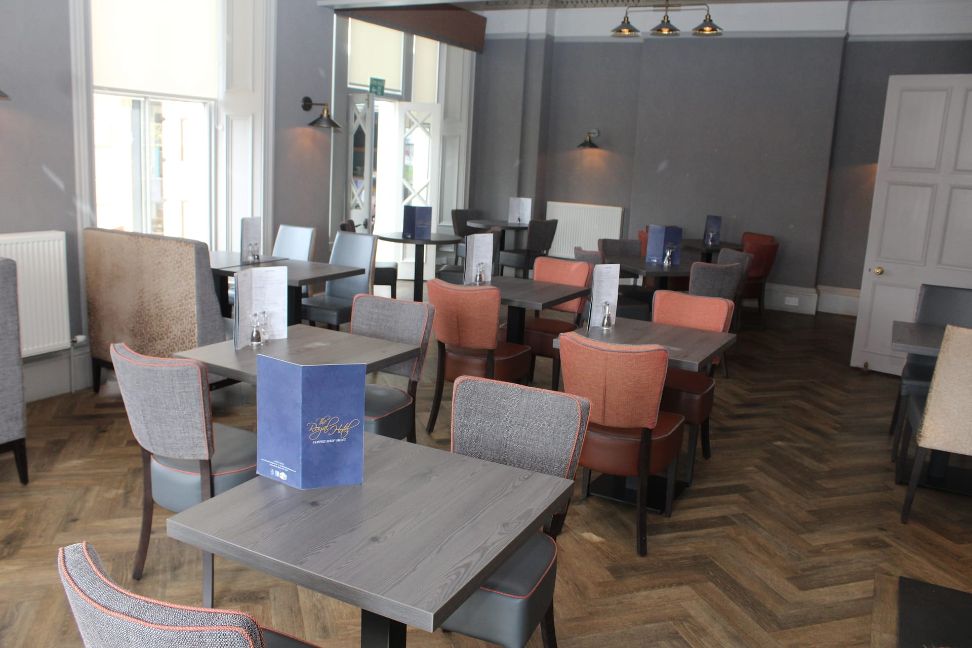 Elgin restaurant featuring tables and chairs for guests to enjoy their dining experience.